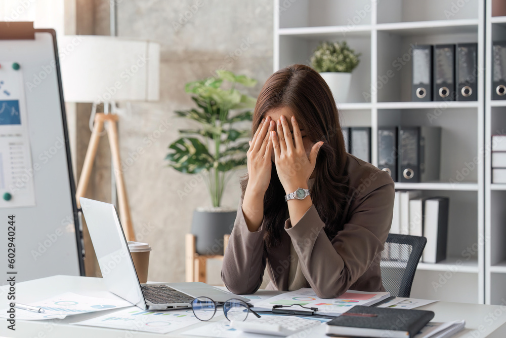 tired business woman sleepy and bored from sitting at a desk for a long time and has office syndrome tired business woman sleepy and bored from sitting at a desk for a long time and has office syndrome