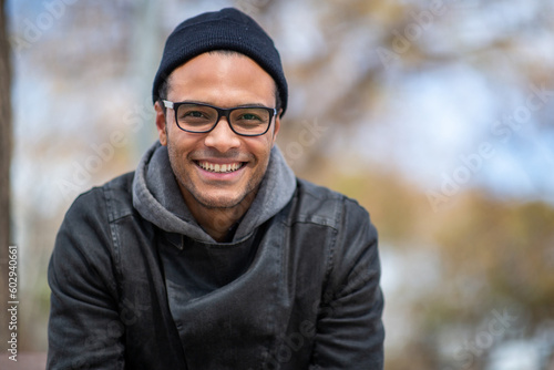 Billede på lærred Handsome young african man outside on a winter day
