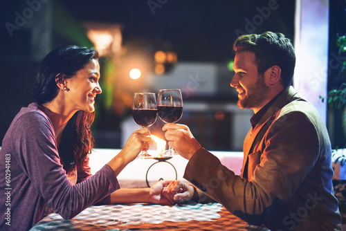 Cheers  wine and couple on date in restaurant  romance and happiness in celebration of love and drinks. Romantic honeymoon night  man and woman toast glasses in cafe  smile on dinner holiday travel.