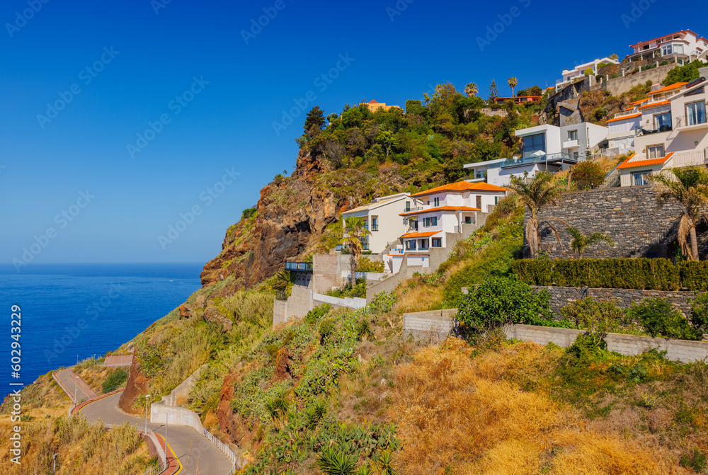 Madeira landscape, settlements built on high cliffs or in the hillsides rising steeply right from the sea shores, Garajau, Madeira island, Portugal