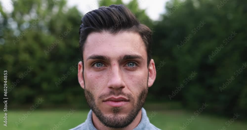 Young man looking at camera outdoor Young man looking at camera outdoor
