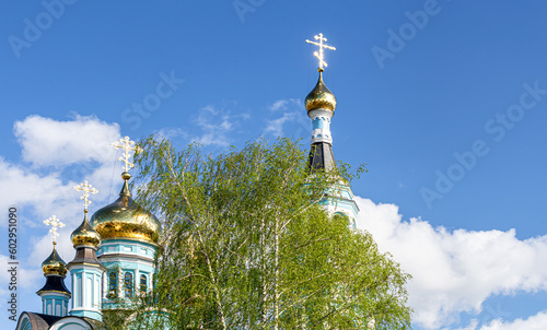 Domes of the Cathedral of St. Tatiana in Cheboksary against the blue sky photo