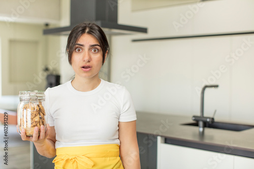 young woman feeling extremely shocked and surprised. cookies concept