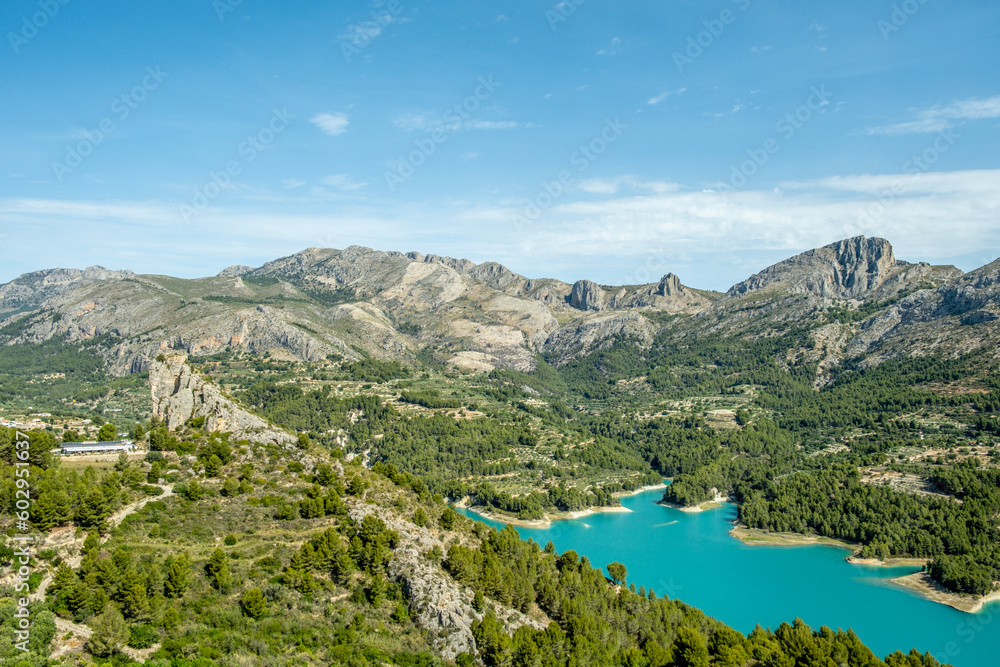 Panoramic view of Guadalest reservoir and Sierra de Serrella mountains. Guadalest is one of most beautiful village of Spain in Alicante province, Valencian Community