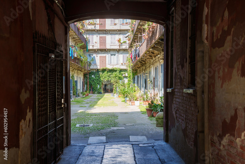 Old residential buildings along via Piero della Francesca in Milan, Italy photo