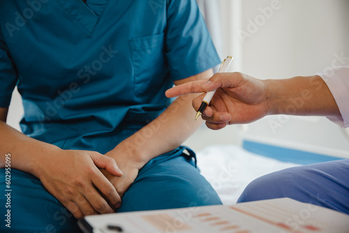 male health concepts. the young man with pain consulted a doctor for treatment. the doctor is interviewing and advising the patients.