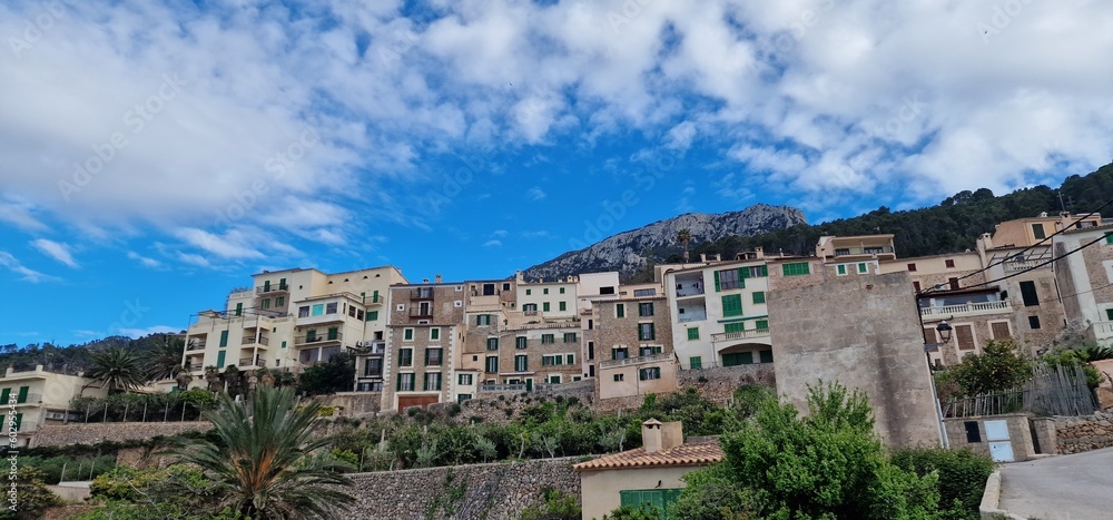 Banyalbufar is a picturesque coastal village nestled in the Tramuntana Mountains terraced landscapes, where centuries-old vineyards cling to the slopes, producing renowned Malvasia wines. The village 