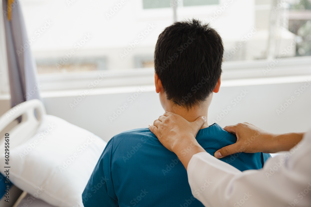 Doctor or Physiotherapist working examining treating injured arm of athlete male patient, stretching and exercise, Doing the Rehabilitation therapy pain in clinic. Doctor or Physiotherapist working examining treating injured arm of athlete male patient, stretching and exercise, Doing the Rehabilitation therapy pain in clinic.