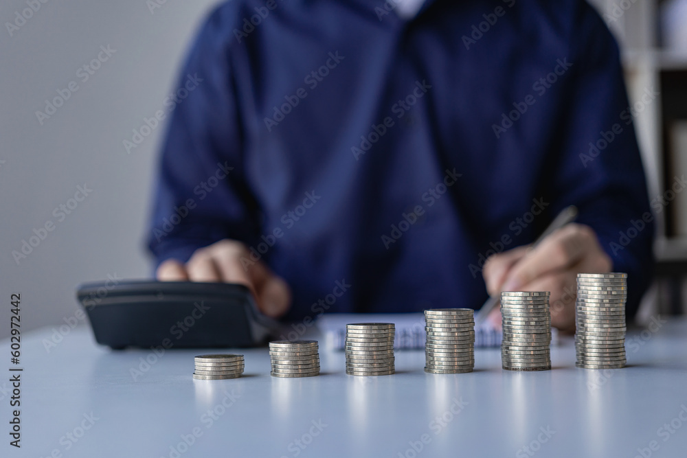 Concepts of financial accounting management in the future, income and expenses, savings and investment management concepts. Key things to consider when planning with stacks of coins