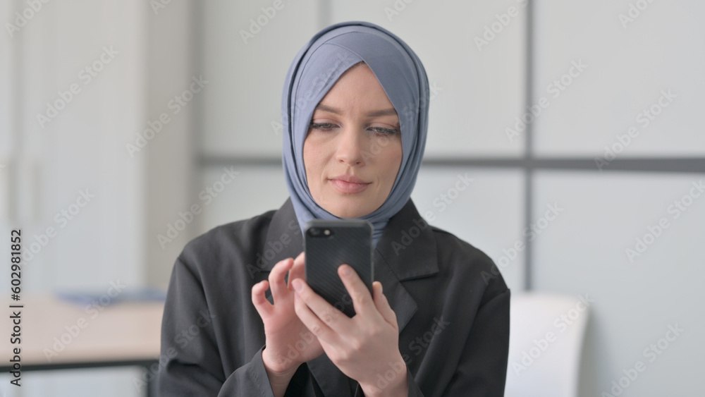 Portrait of Muslim Businesswoman using Smartphone Portrait of Muslim Businesswoman using Smartphone