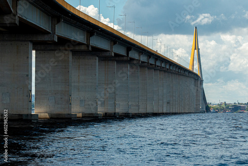 View of Amazonas landscape with Rio Negro Bridge or Ponte Rio Negro, Journalist Philippe Dahsou Bridge near Manaus in Brazil, Amazonas with blue sky