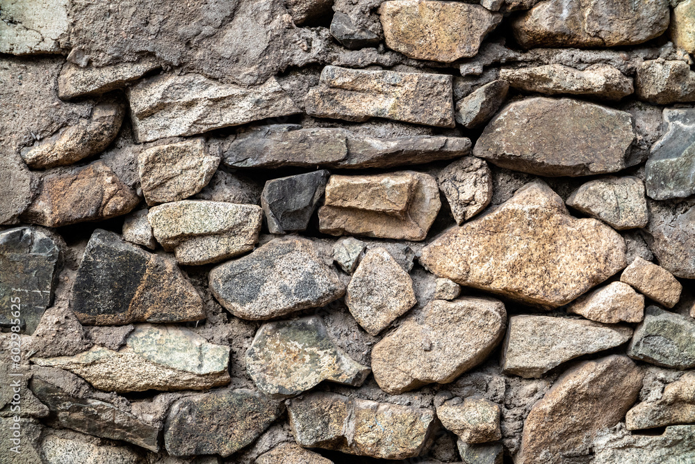 Background of natural stones bonded with cement mortar. Background of natural stones bonded with cement mortar.