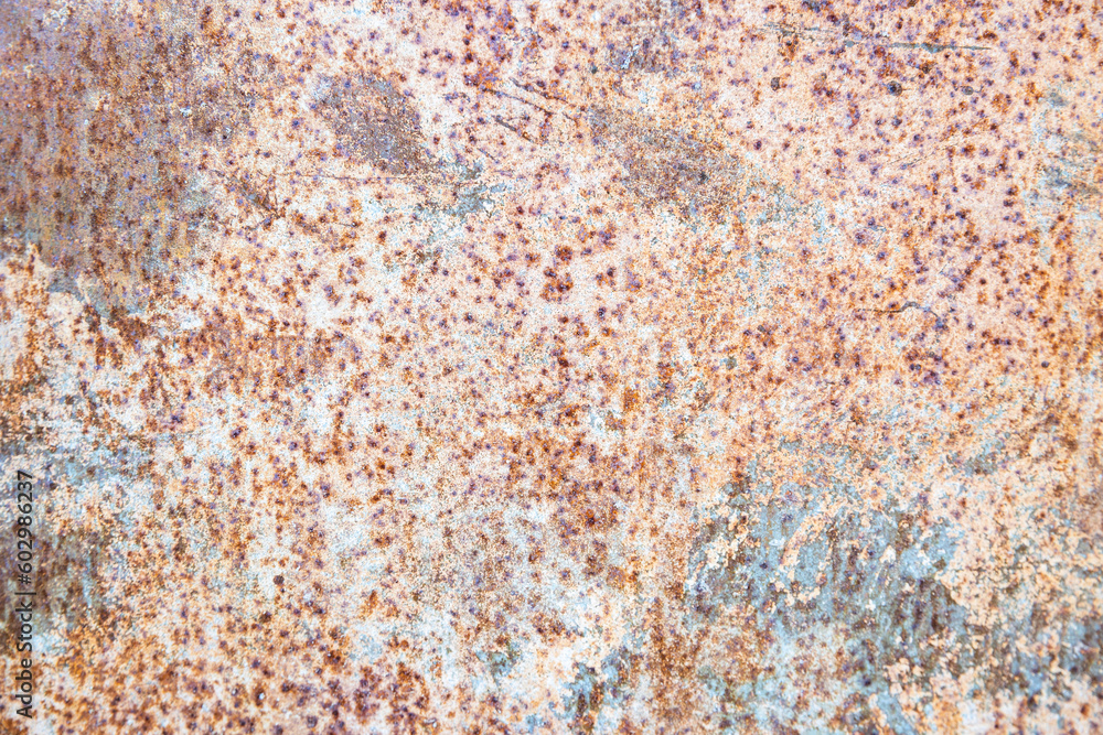 Old rusty metal texture on the surface of an iron sheet with pitting, grunge background. Old rusty metal texture on the surface of an iron sheet with pitting, grunge background.