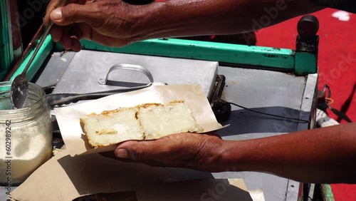 Kue rangin or also called sagu rangin is an Indonesian coconut cookies or traditional snack made of a coconut and starch-based batter and cooked in a special molded pan photo