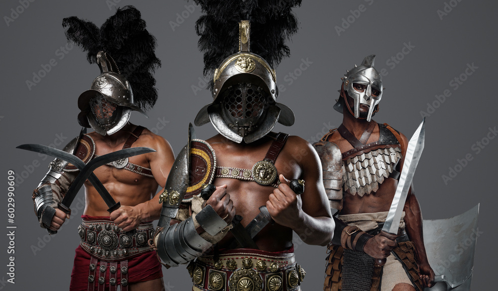 Studio shot of antique roman warriors dressed in armors and plumed helmets. Studio shot of antique roman warriors dressed in armors and plumed helmets.