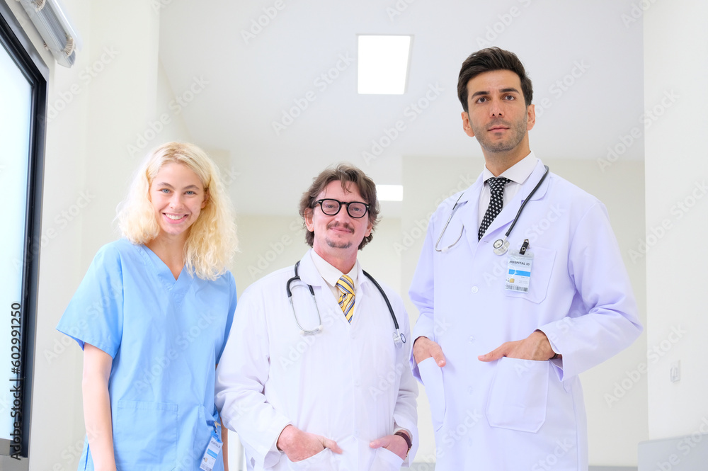 Smiling medical team standing in the hospital medical concept. Smiling medical team standing in the hospital medical concept.