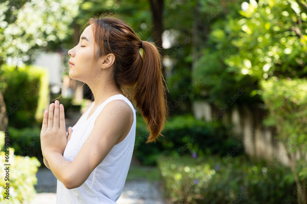 healthy happy active yoga woman in park, prayer hands; concept of woman with nature, good environment, ecological system, global warming, healthy lifestyle, people in nature, fresh air, no pollution healthy happy active yoga woman in park, prayer hands; concept of woman with nature, good environment, ecological system, global warming, healthy lifestyle, people in nature, fresh air, no pollution