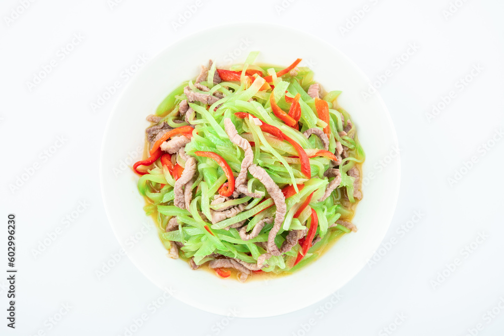 Fried meat with shredded lettuce on a plate on a white background Fried meat with shredded lettuce on a plate on a white background