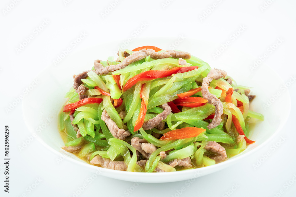 Fried meat with shredded lettuce on a plate on a white background