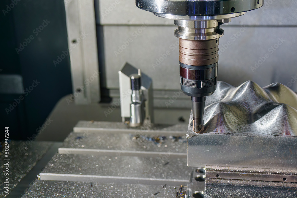 The CNC milling machine rough cutting the mold parts by indexable ball tools. The CNC milling machine rough cutting the mold parts by indexable ball tools.