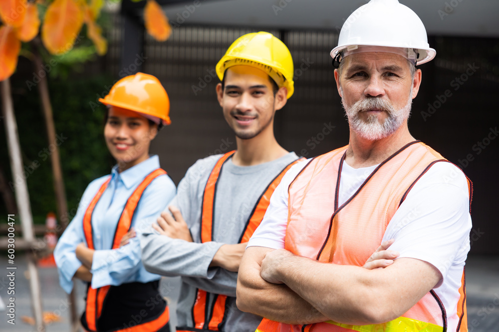 Arms crossed. Professional team working at workplace. Unity and teamwork concept. Portrait engineer factory manager worker and mechanic team together in factory workplace Arms crossed. Professional team working at workplace. Unity and teamwork concept. Portrait engineer factory manager worker and mechanic team together in factory workplace