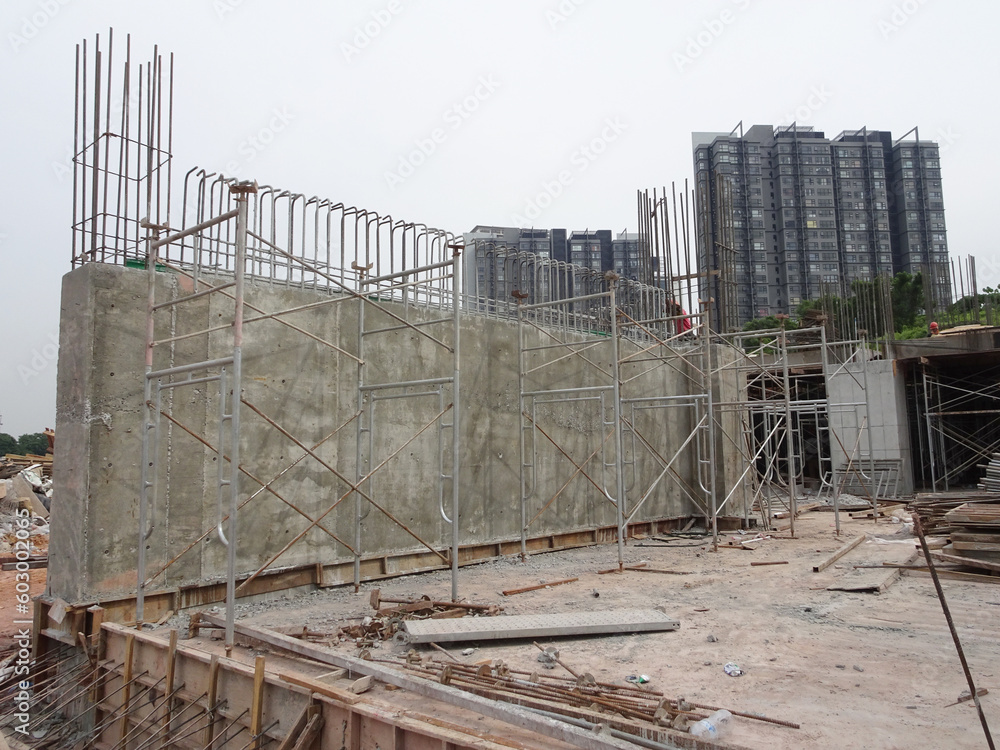 SELANGOR, MALAYSIA - JULY 23, 2022: Retaining wall is under construction. The retaining wall was built according to the engineer's design. The site is excavated to build the foundation structure
