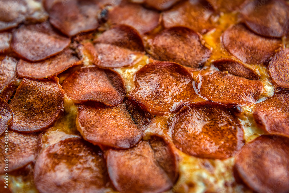 Delicious pepperoni on pizza texture
