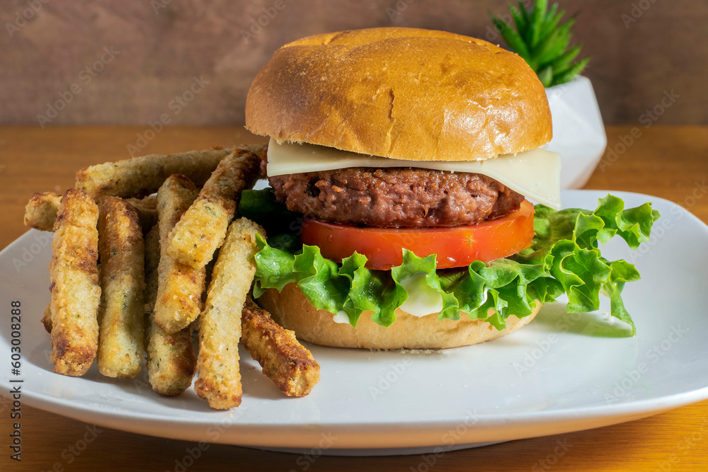 plant based burger with a side of broccoli fries plant based burger with a side of broccoli fries
