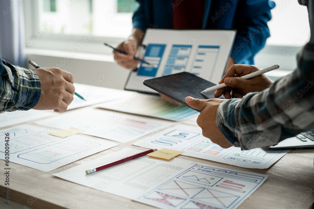 Group of asian creative team programing designers participate in all phases of the UX design. Group of asian creative team programing designers participate in all phases of the UX design.