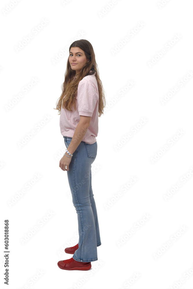 side view of a young girl standing and looking at camera on white background side view of a young girl standing and looking at camera on white background