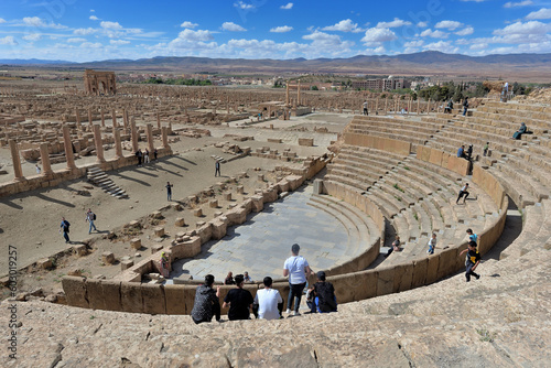 ANCIENT ROMAN THEATRE IN THE ARCHEOLOGICAL SITE OF TIMGAD IN ALGERIA