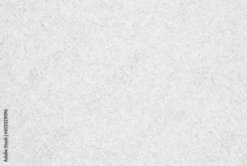 A sheet of white fibrous craft paper texture as background