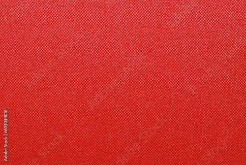 Red color glossy craft paper texture as background 