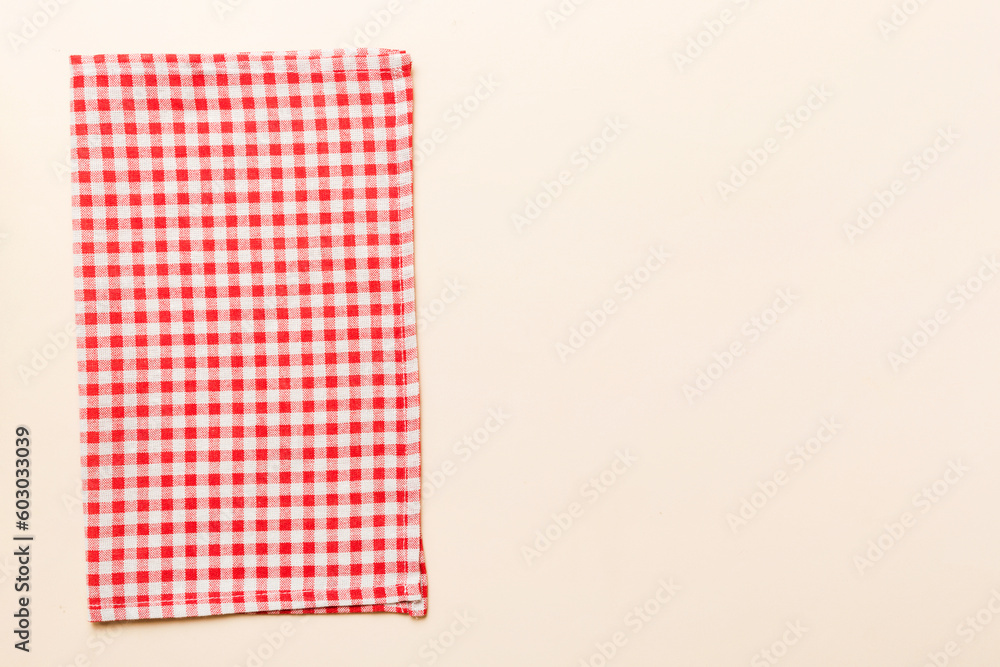 top view with red empty kitchen napkin isolated on table background. Folded cloth for mockup with copy space, Flat lay. Minimal style top view with red empty kitchen napkin isolated on table background. Folded cloth for mockup with copy space, Flat lay. Minimal style