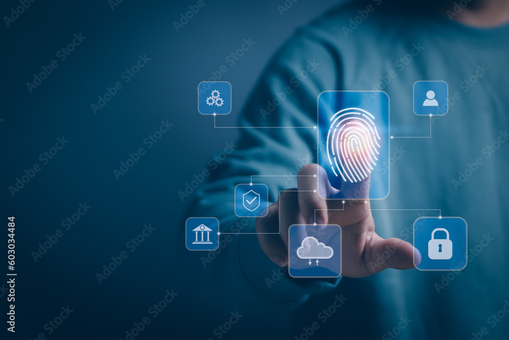 Businessman scans fingerprints on virtual screen for login identification to transact on Internet or manage personal information, technology secure concept cyber security Businessman scans fingerprints on virtual screen for login identification to transact on Internet or manage personal information, technology secure concept cyber security