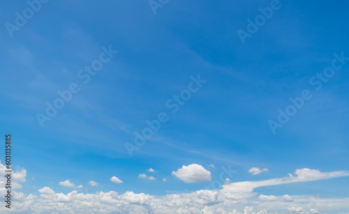 Panoramic view of clear blue sky and clouds, Blue sky background with tiny clouds. White fluffy clouds in the blue sky. © pinglabel