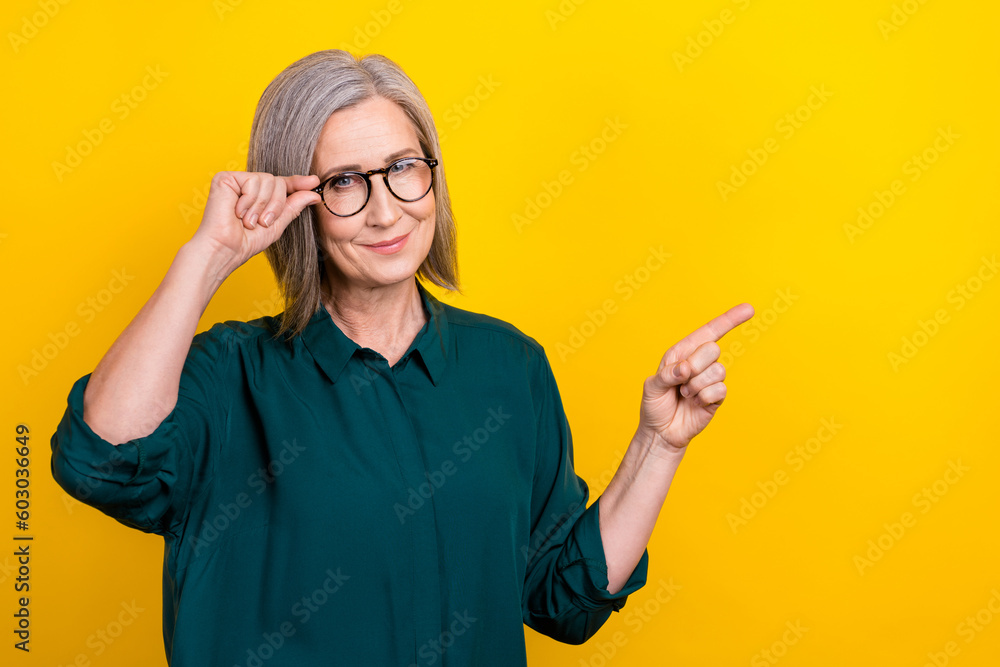Photo of manager promoter lady point finger empty space eyesight checkup advert isolated bright color background Photo of manager promoter lady point finger empty space eyesight checkup advert isolated bright color background