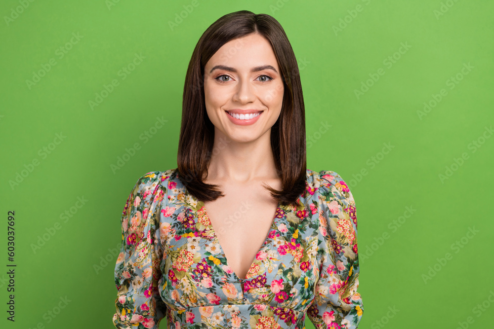Fototapeta premium Photo of lovely positive girl beaming smile good mood wear floral dress isolated on green background