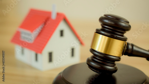 Fair hammer, hammer and wooden house The concept is used in real estate law agreements.
