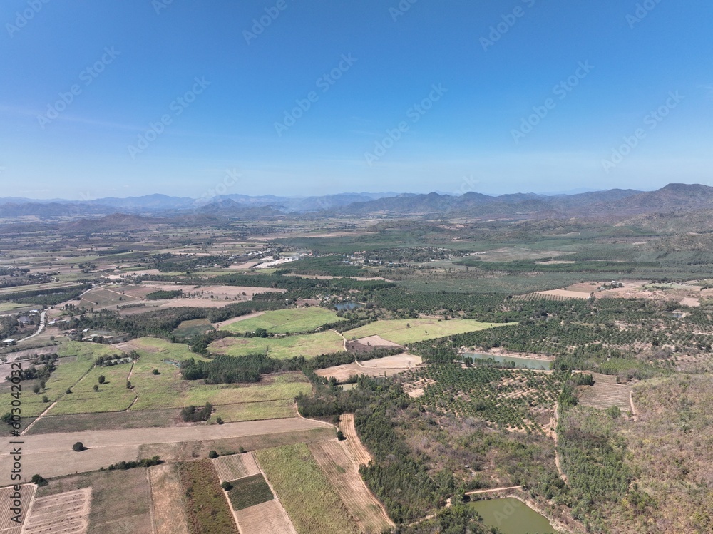 High angle view landscape of Kanchanaburi province, Thailand with cityscape view by the field, land, mountain, buildings within the city.