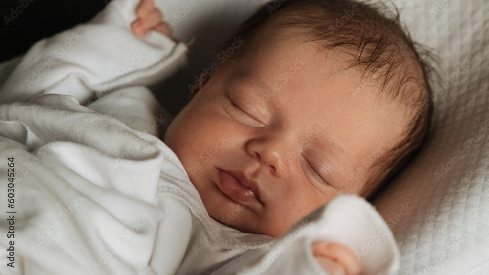Beautiful caucasian newborn baby. Child sleeping in bed. Little kids concept. Close-up portrait Beautiful caucasian newborn baby. Child sleeping in bed. Little kids concept. Close-up portrait