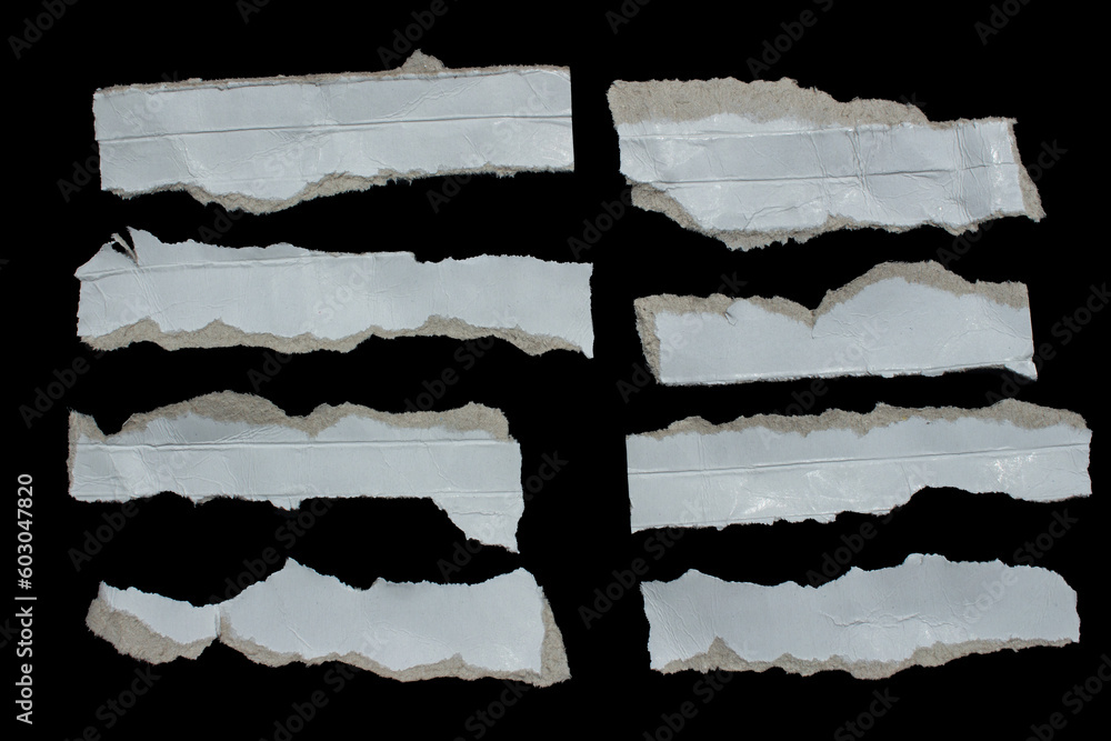 Set of torn paper pieces isolated on black background. Ripped papers for your designs.