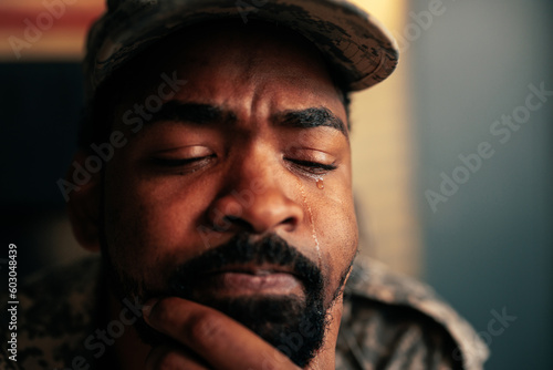 Close up on American soldier crying in office.
