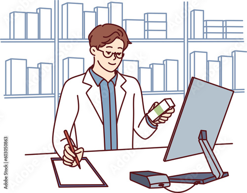 Man pharmacist in medical coat stands behind counter in pharmacy and prescribes prescription drugs