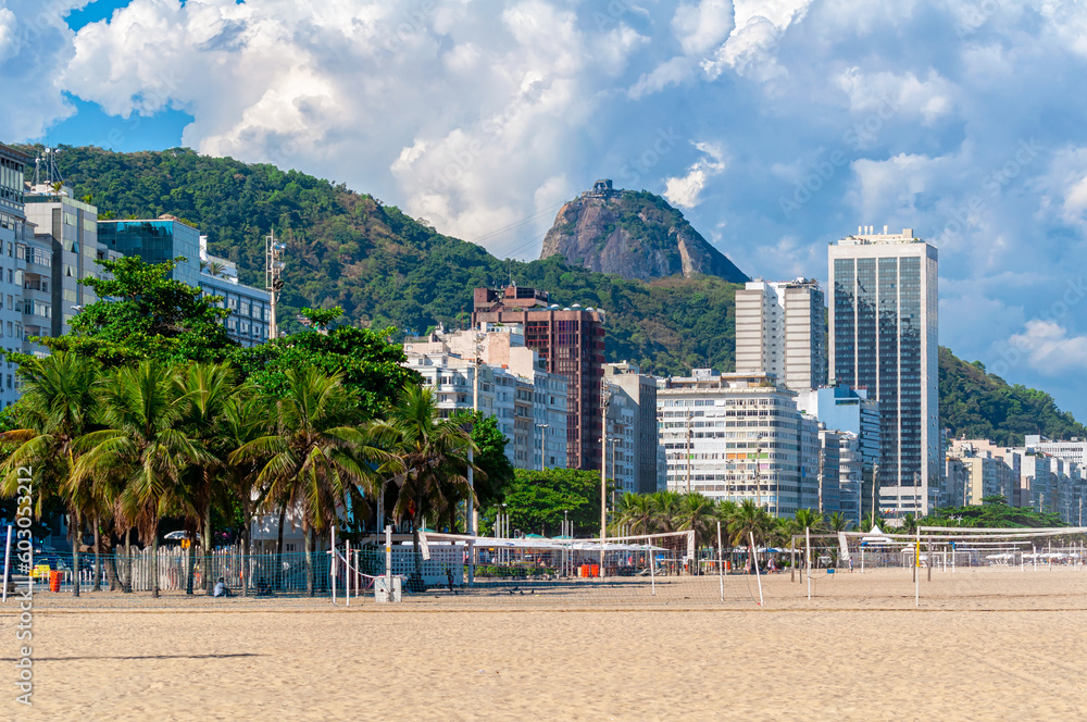 Copacabana beach and mountain Sugarloaf in Rio de Janeiro, Brazil. Copacabana beach is the most famous beach in Rio de Janeiro. Sunny cityscape of Rio de Janeiro Copacabana beach and mountain Sugarloaf in Rio de Janeiro, Brazil. Copacabana beach is the most famous beach in Rio de Janeiro. Sunny cityscape of Rio de Janeiro