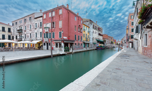 Traditional Venetian houses along the canal at sunrise. © pillerss