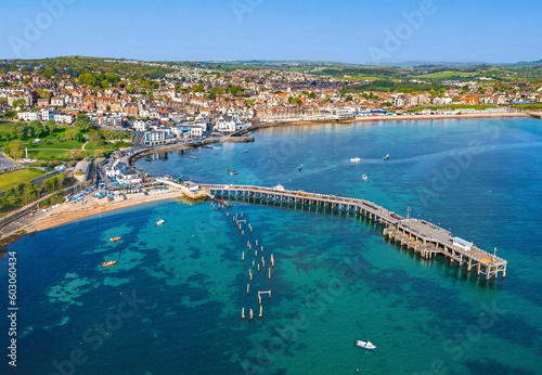 Canvas Print High Tide rolls in around the Piers of Swanage Bay, Dorset, United Kingdom