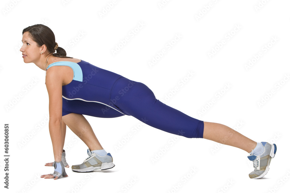 Young woman doing a lunge during a fitness exercise. Young woman doing a lunge during a fitness exercise.