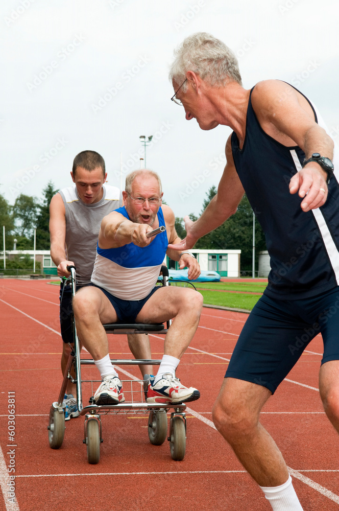 Disabled person and his helper reaching for an other athlete to pass him the baton. Caricature