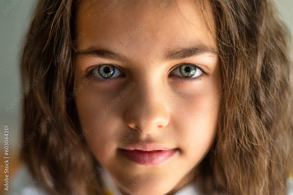 Close-up Of The Face Of A Beautiful Little Girl Who Has Stunning Green Eyes And Is Looking At The Camera Close-up Of The Face Of A Beautiful Little Girl Who Has Stunning Green Eyes And Is Looking At The Camera